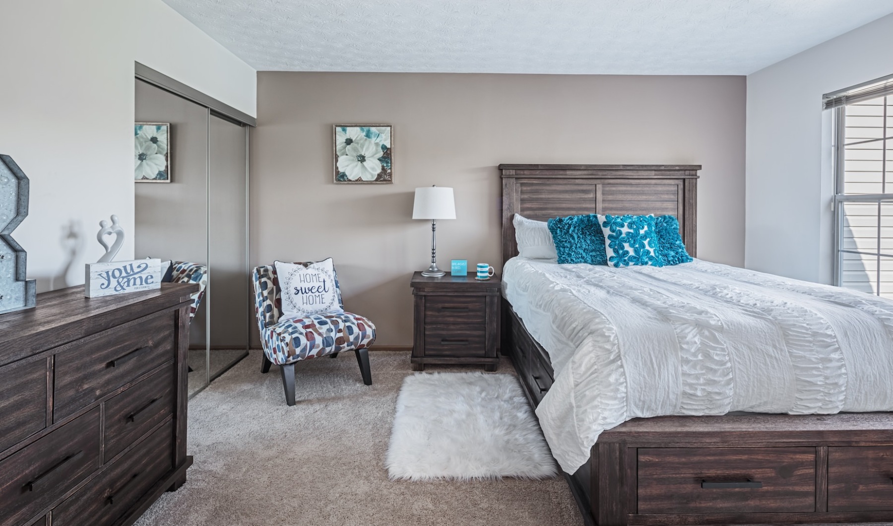 Find your apartment in Dublin, Ohio bedroom space with bed, chair, and dresser