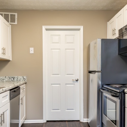 kitchen with white cabinetry and appliances